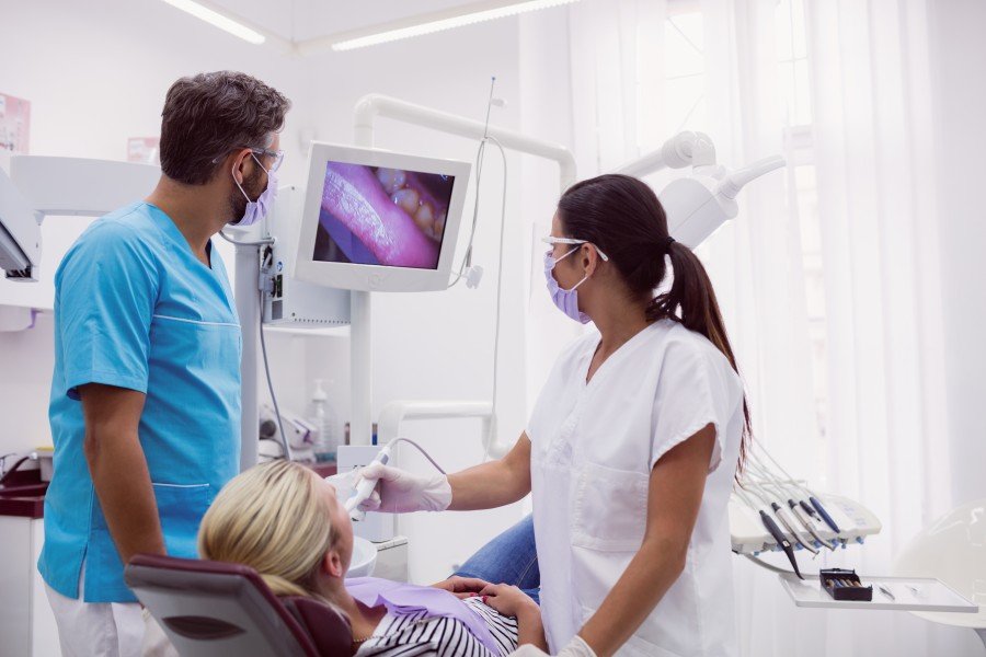 Dentist examining a patient during a routine dental checkup